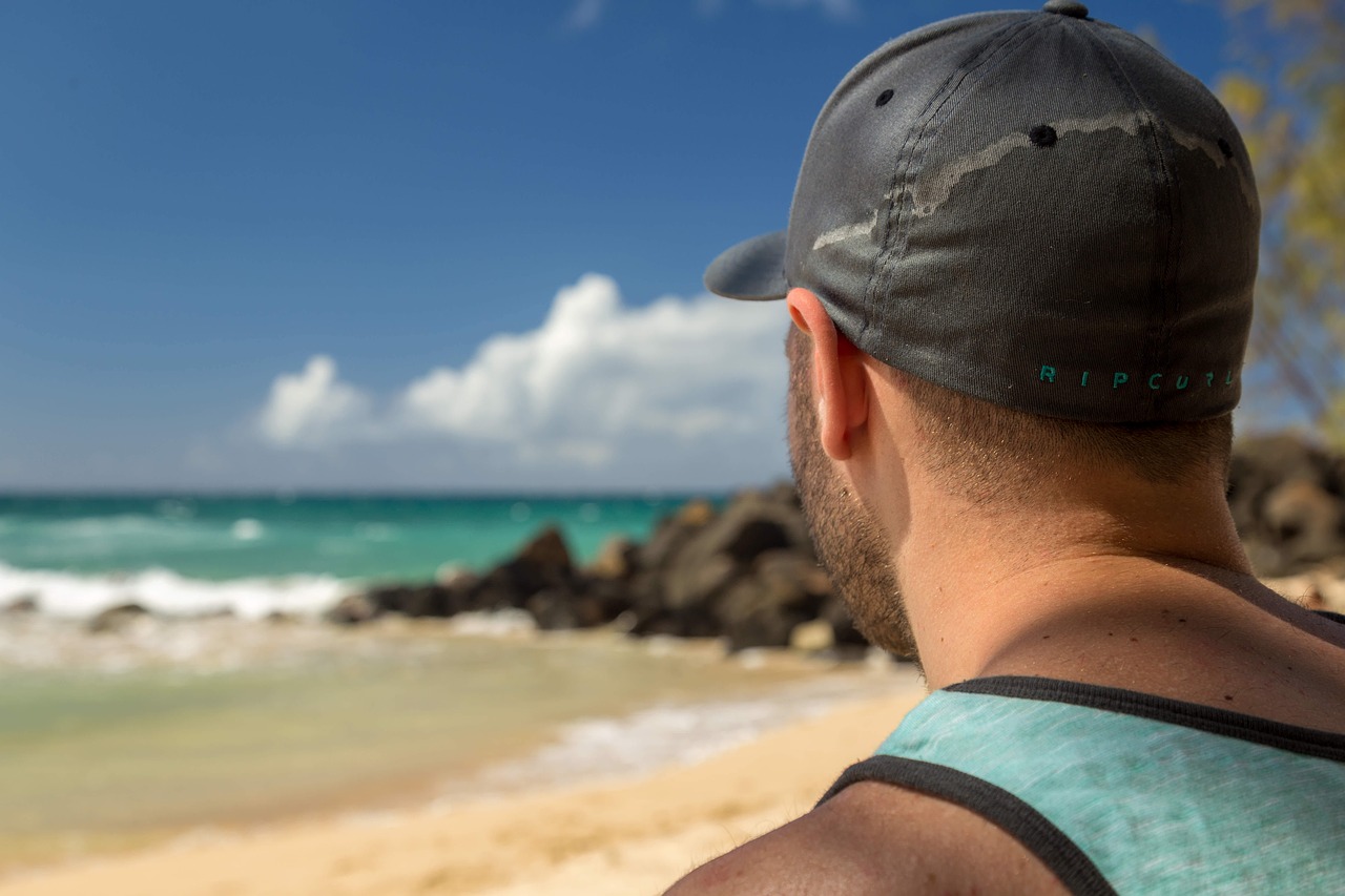 Image - beach blur cap close up clouds