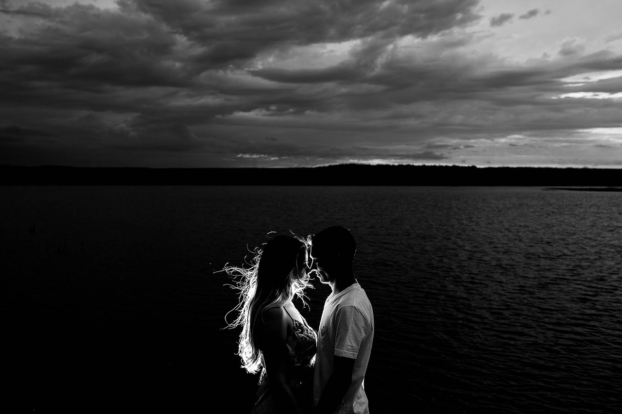 Image - beach clouds couple dark dress