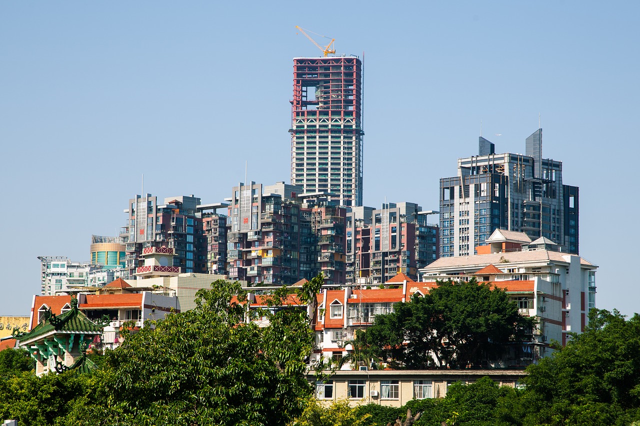 Image - tall buildings house red tile trees