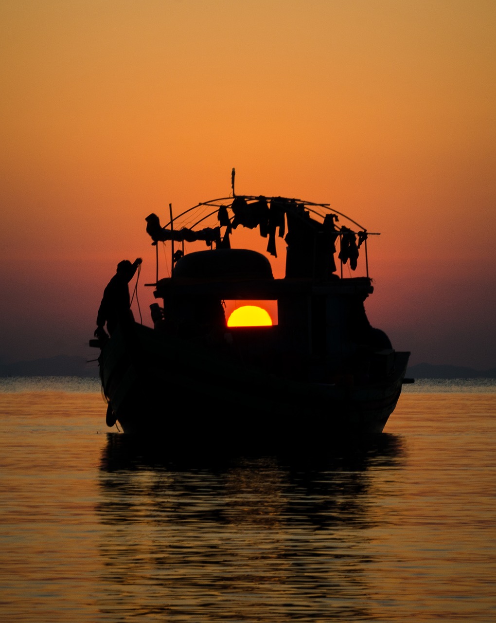 Image - sunset the boat man light sky