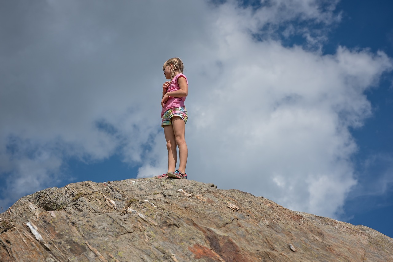 Image - child girl blond mountain rock