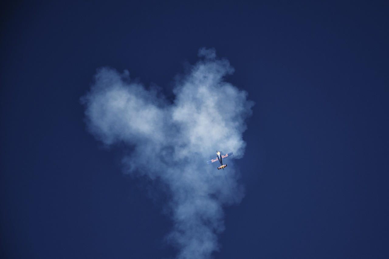 Image - sky aircraft red bull smoke clouds