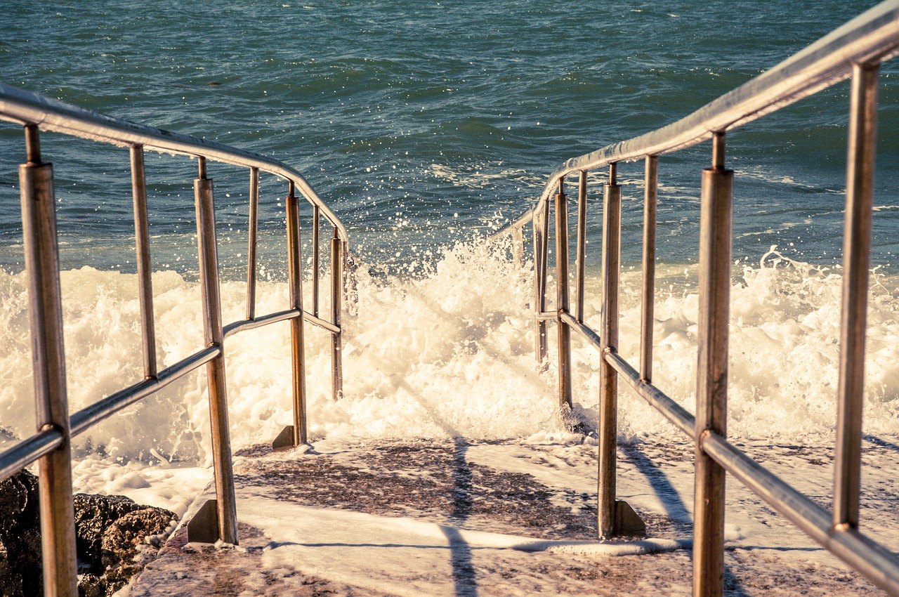 Image - sea wave shores railing water