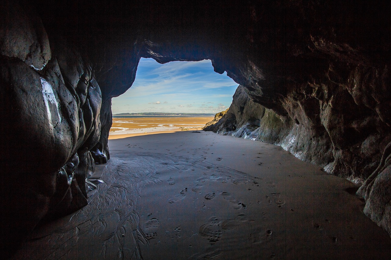 Image - cave low tide beach ocean wales