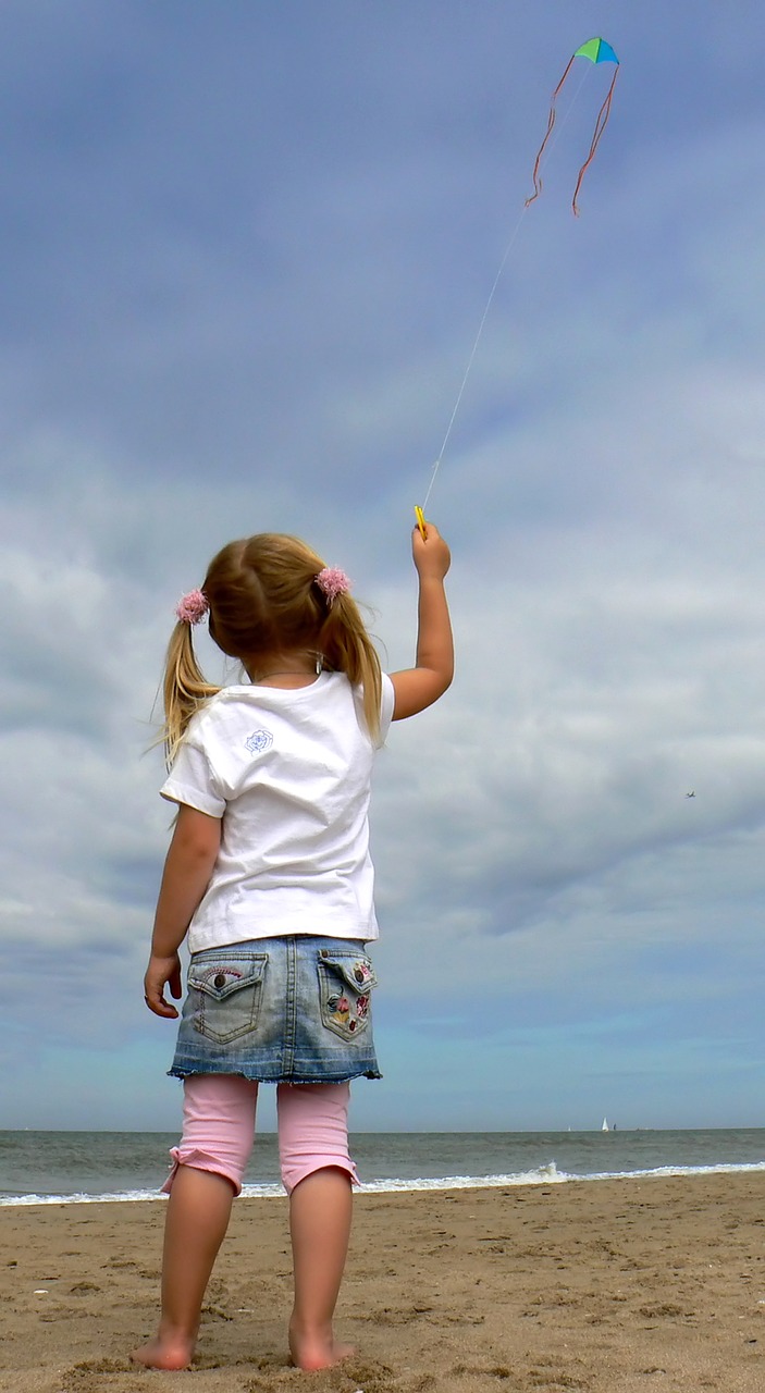 Image - kite child sky beach lottle girl