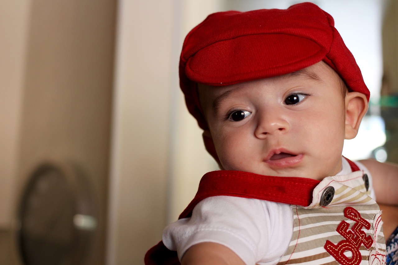 Image - baby smiling bonnet cap red