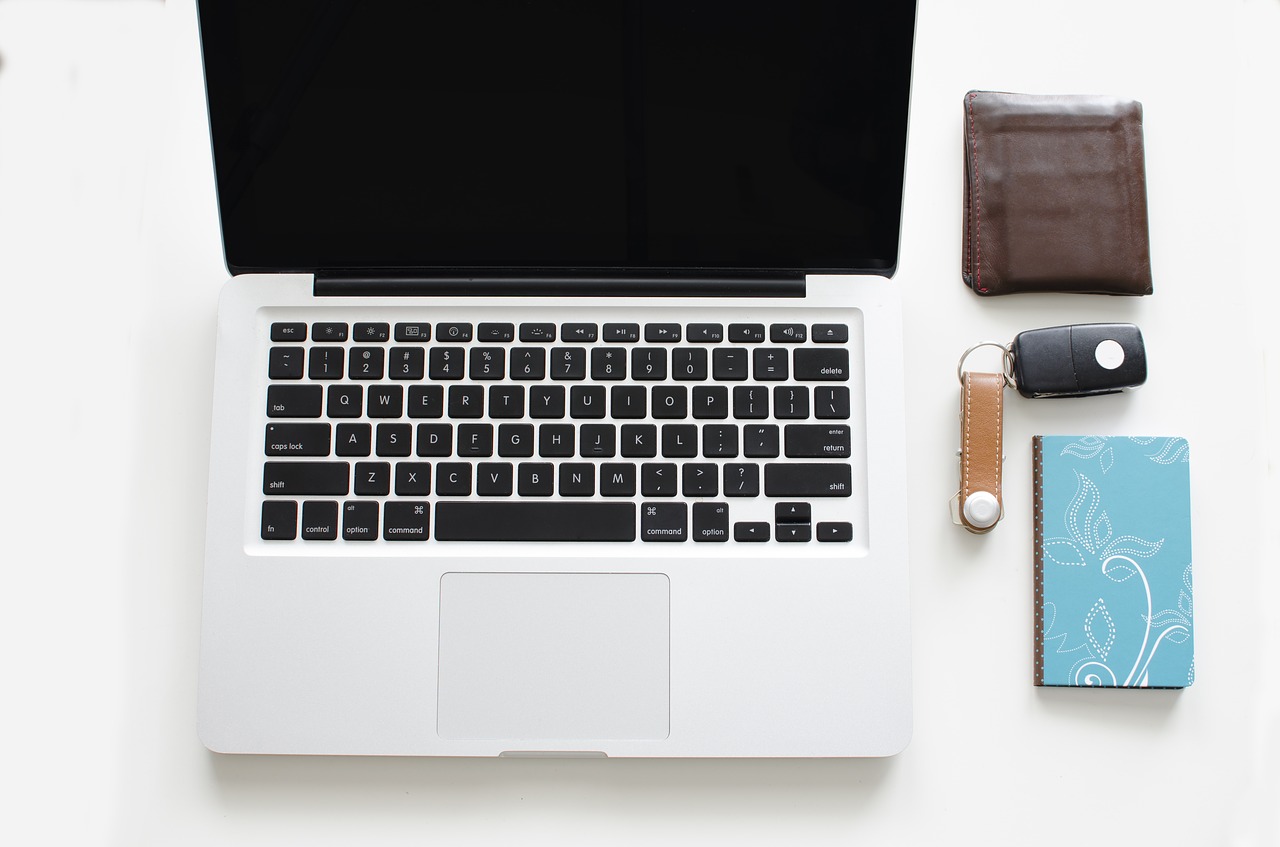 Image - busy home desk paper laptop view