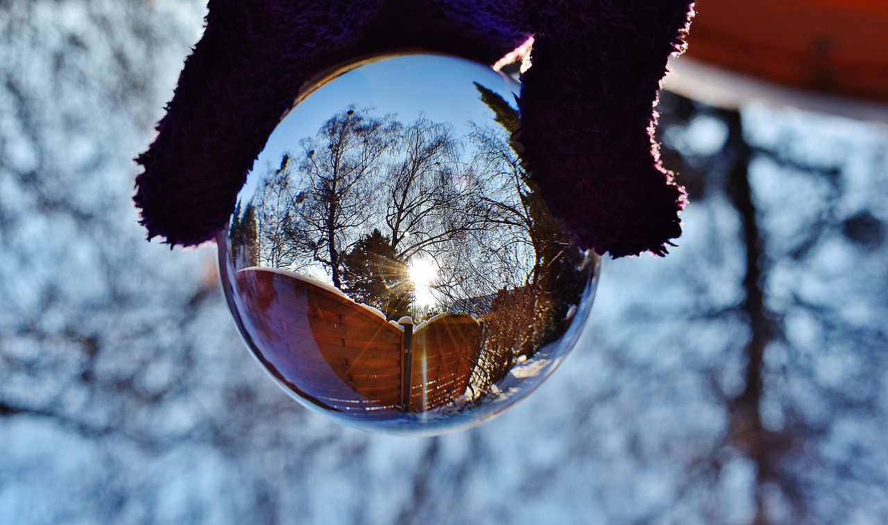 Image - glass ball mirroring sun winter