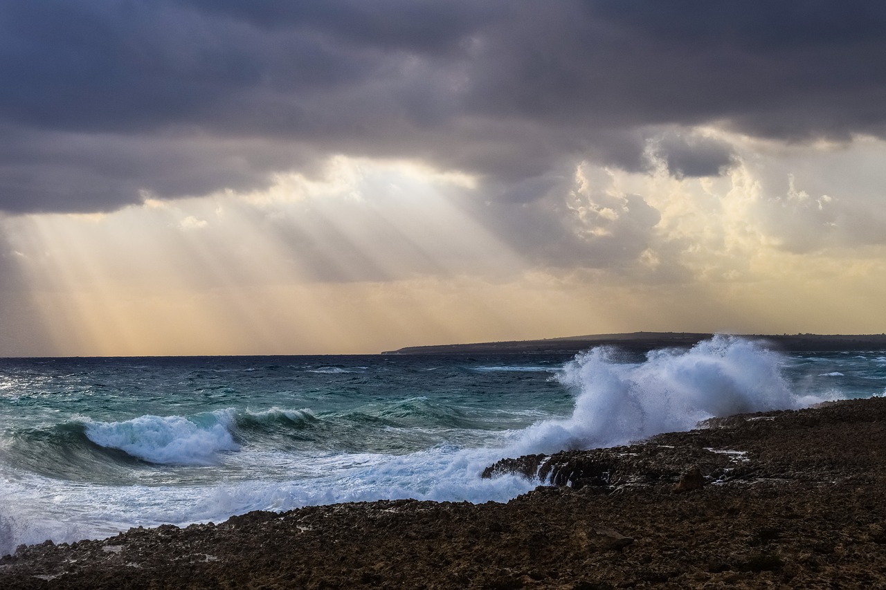 Image - waves storm clouds sunbeam coast