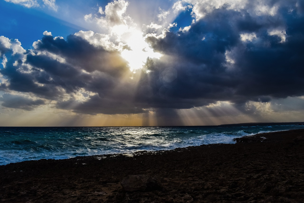 Image - waves storm clouds sunbeam coast