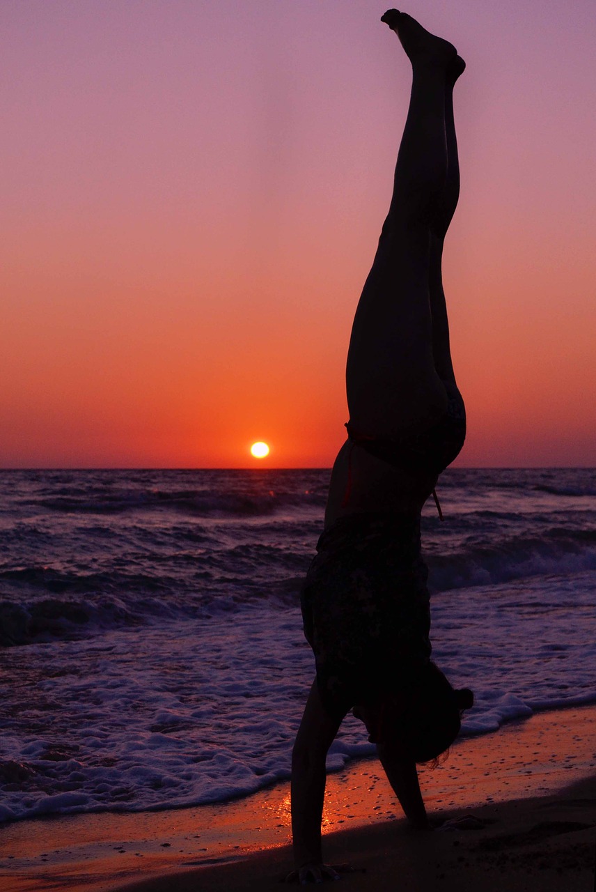 Image - woman silhouette standing on hands