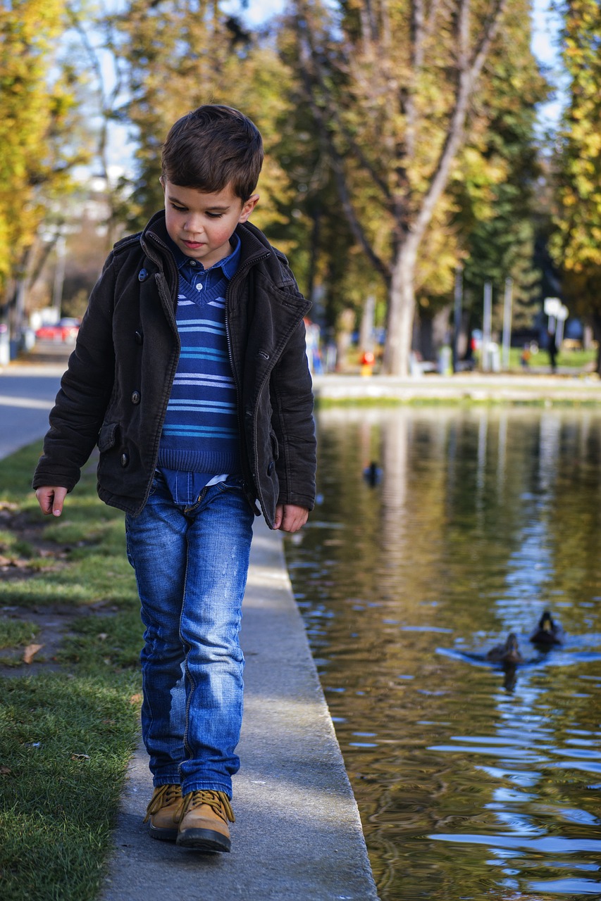 Image - toddler walking by the water