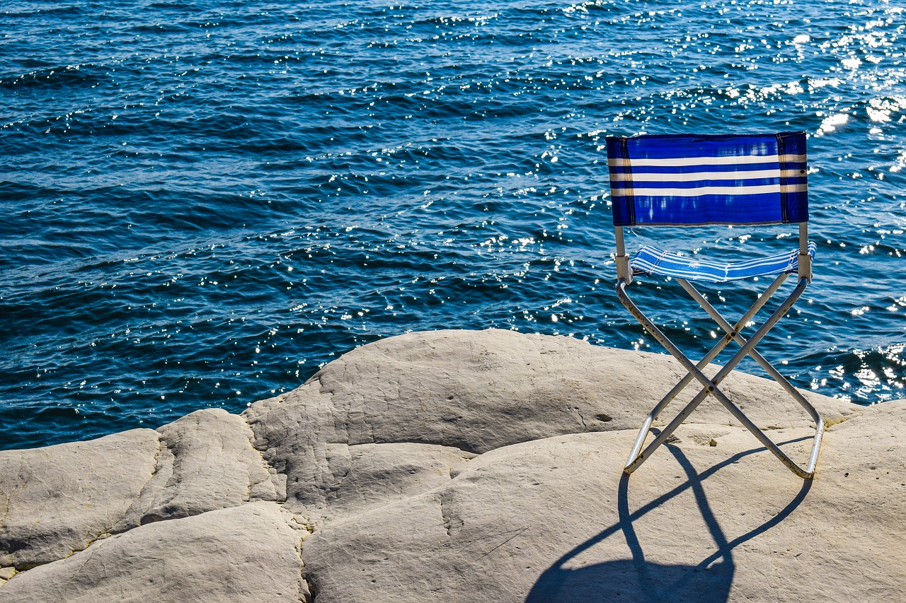 Image - chair blue sea rock white beach