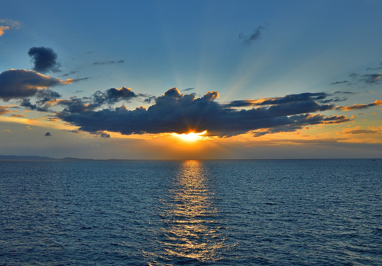 Image - sunrise water sky mirroring sea