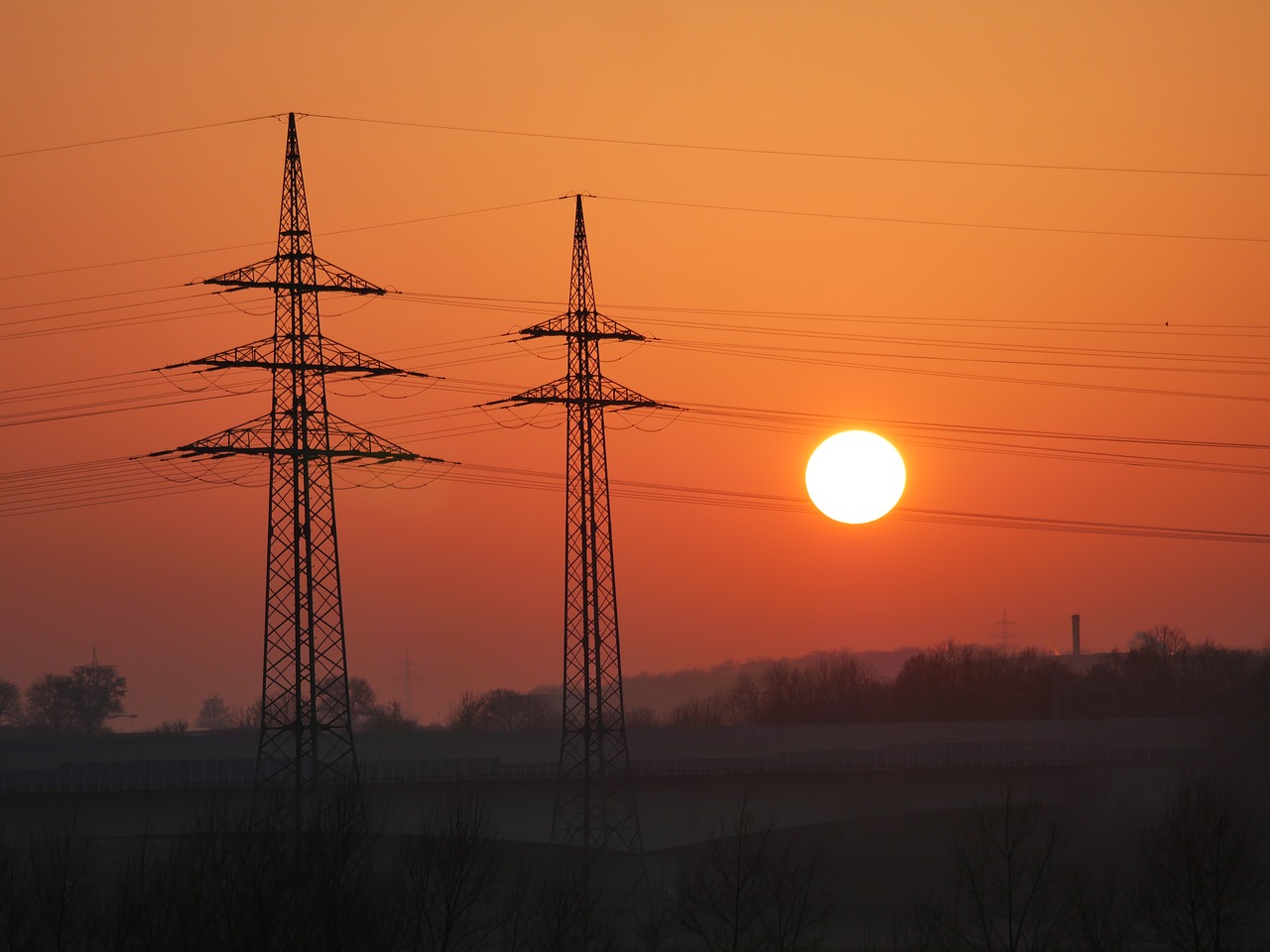 Image - dusk power poles industry traffic
