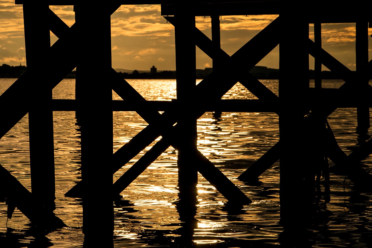 Image - sunset silhouette pier lake water