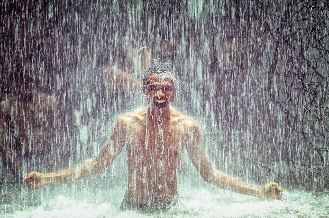 Image - man under waterfall power waterfall