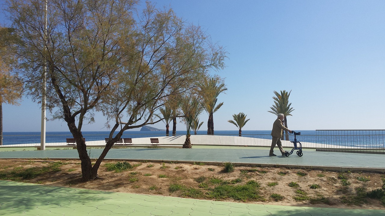 Image - benidorm promenade beach old man