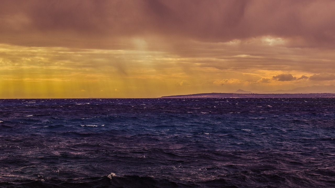 Image - sea waves storm clouds sunbeam