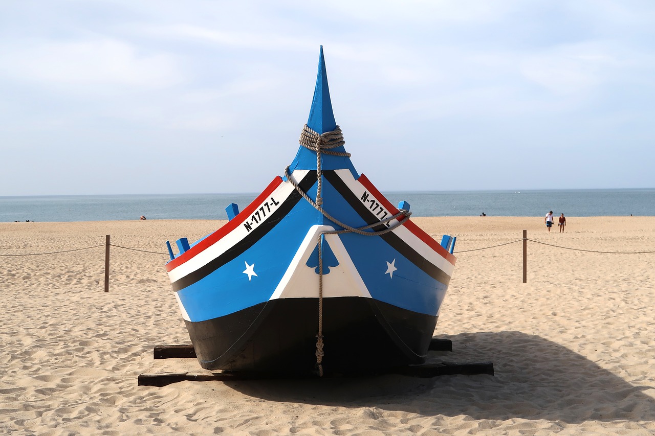 Image - nazareth portugal boat beach city