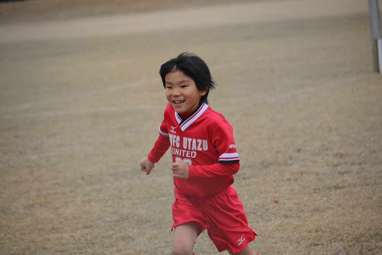 Image - elementary school football boy run