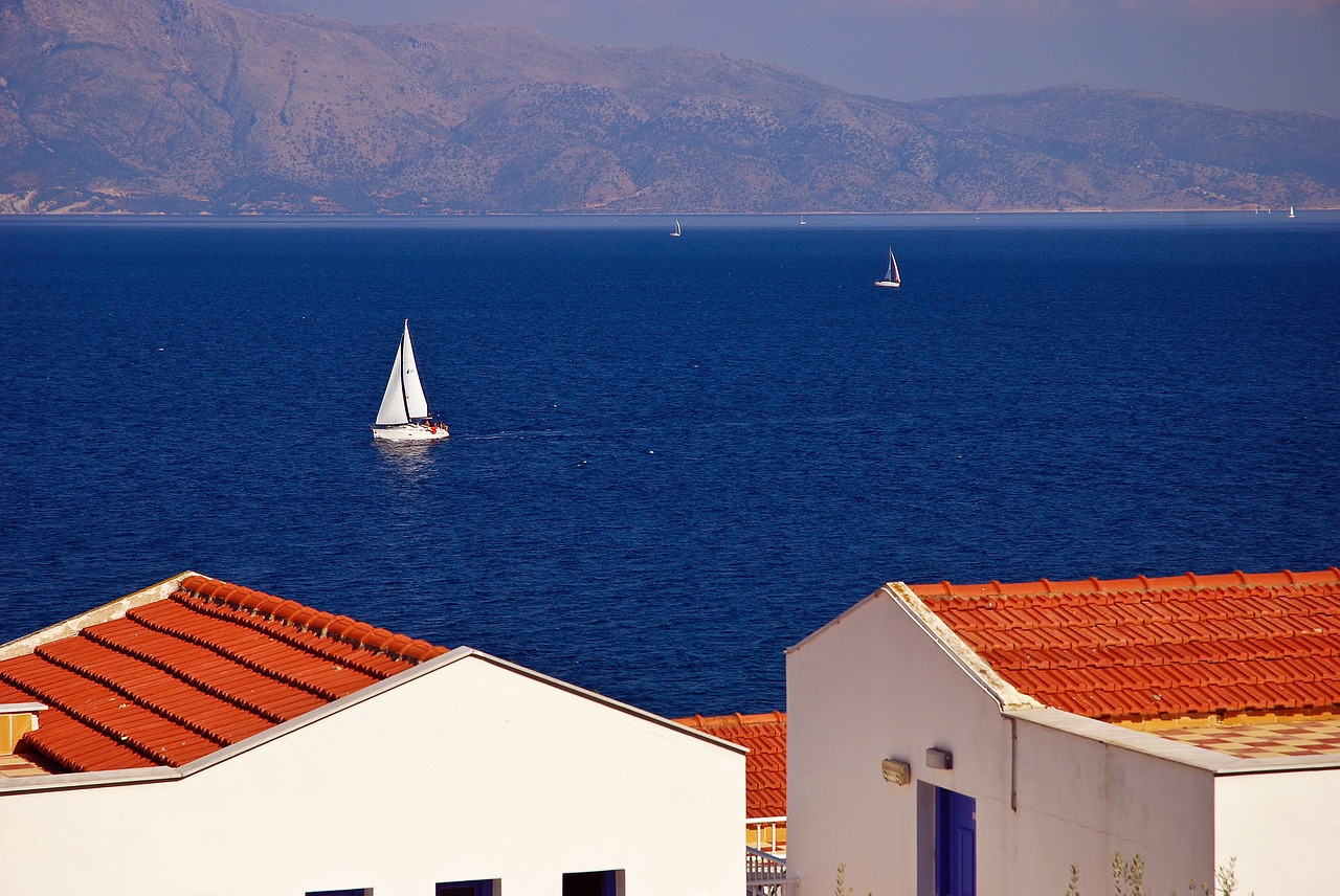 Image - greece sea sailboat roof mountains