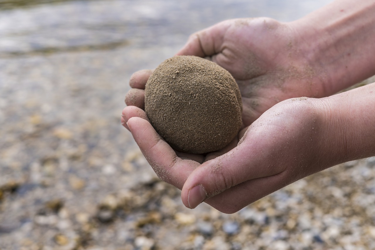 Image - sand ball hands child bank lake