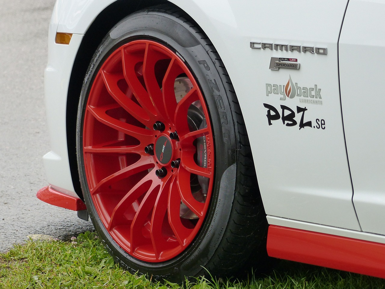 Image - rim red car grass exhibition