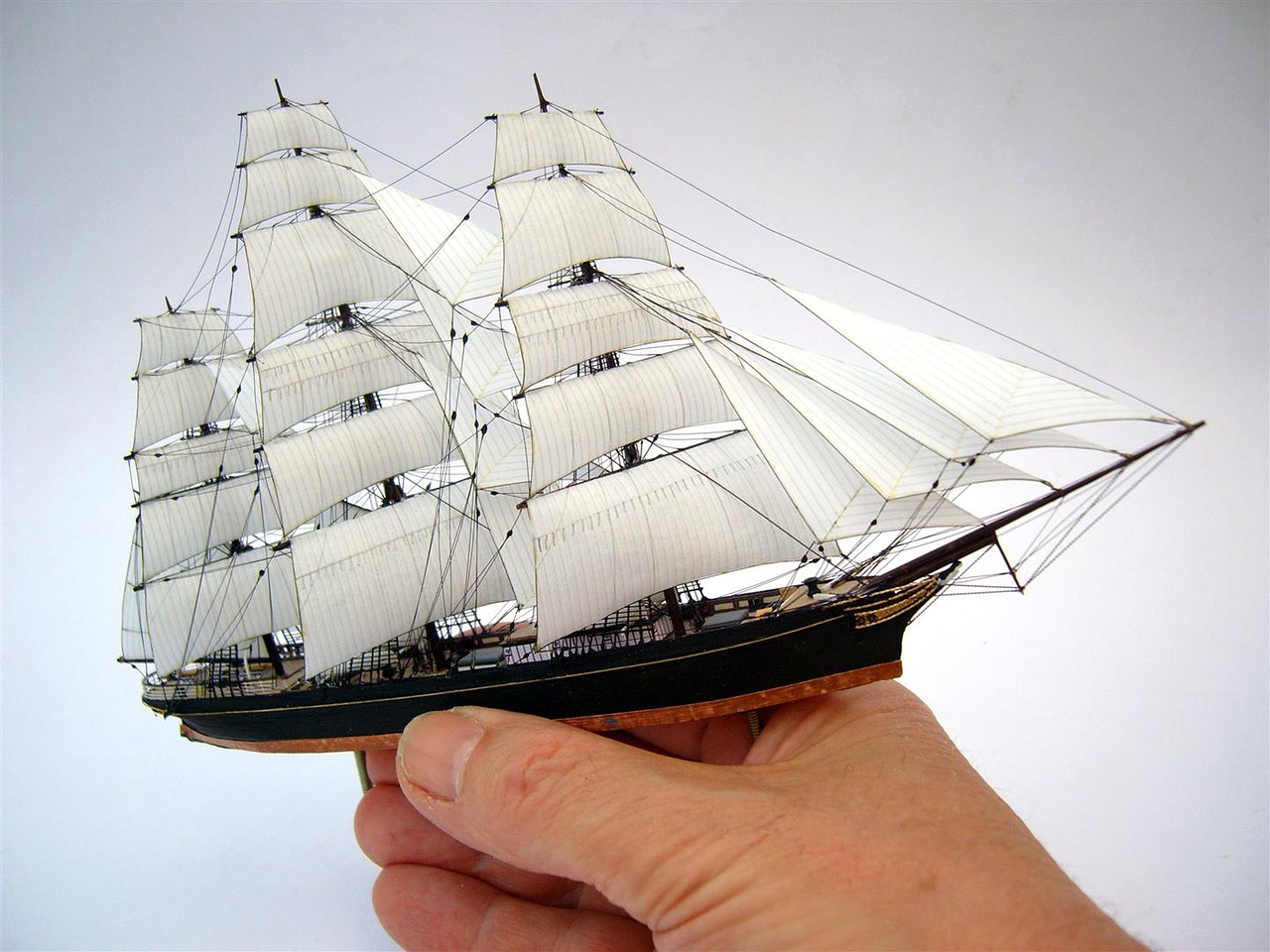 Image - miniature sailing ship model hand