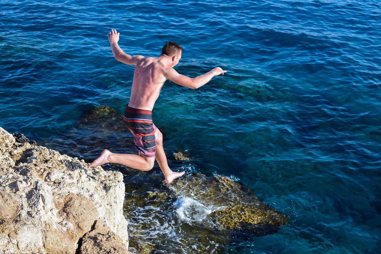 Image - jump rock cliff sea action summer