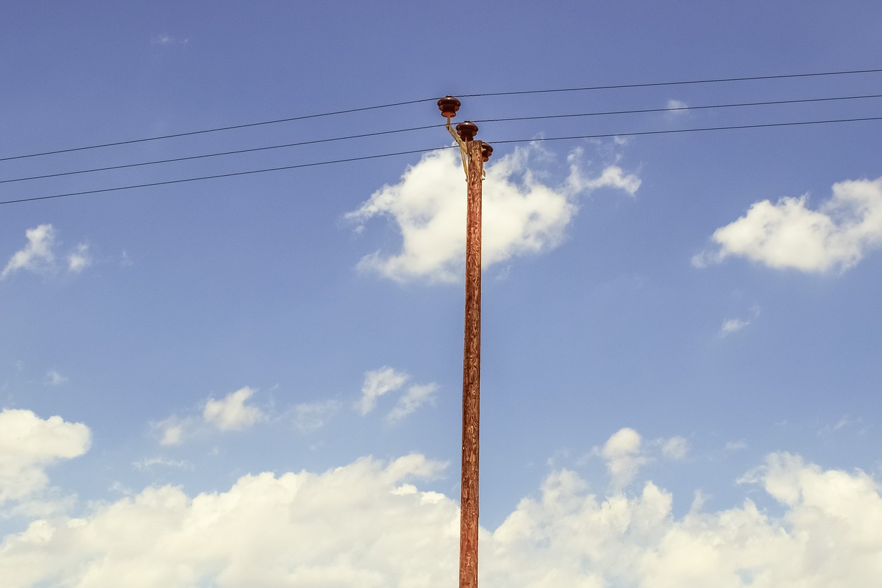 Image - pole sky clouds wires telephone