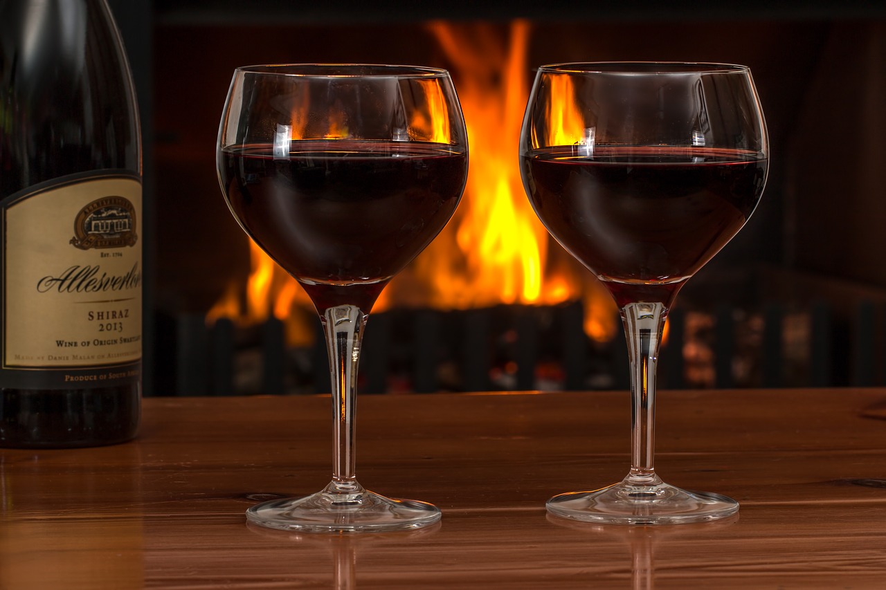 Image - red wine glasses log fire red wine