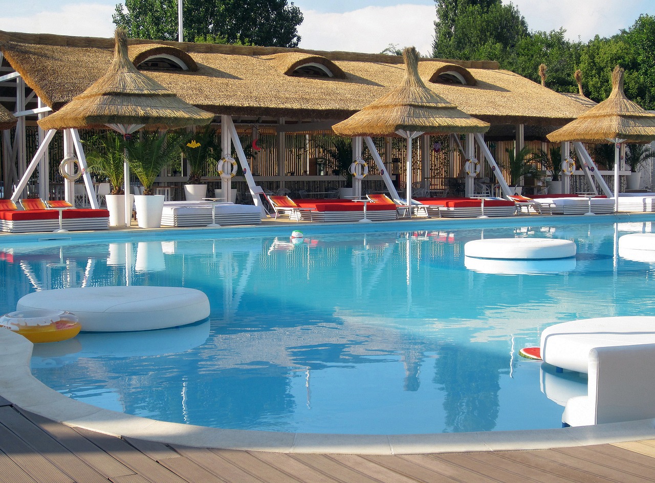 Image - water park thatch umbrellas blue