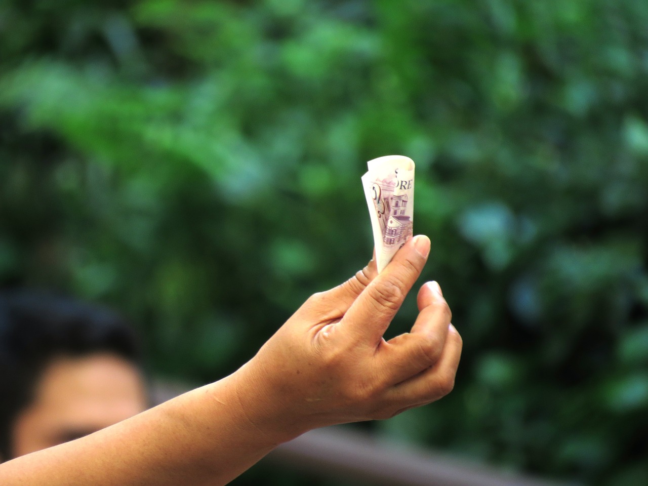 Image - hand money singapore