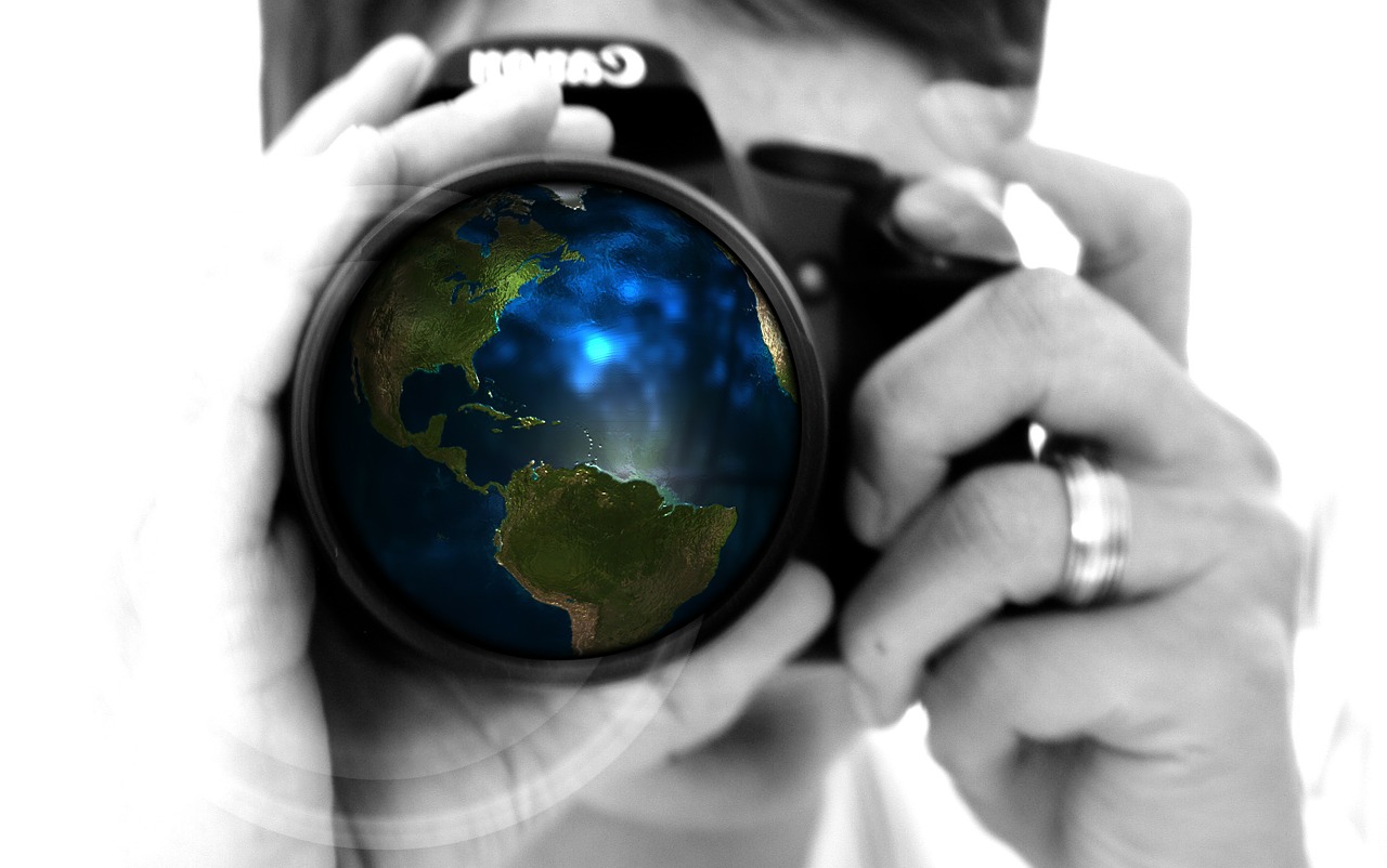 Image - woman camera hand lens earth