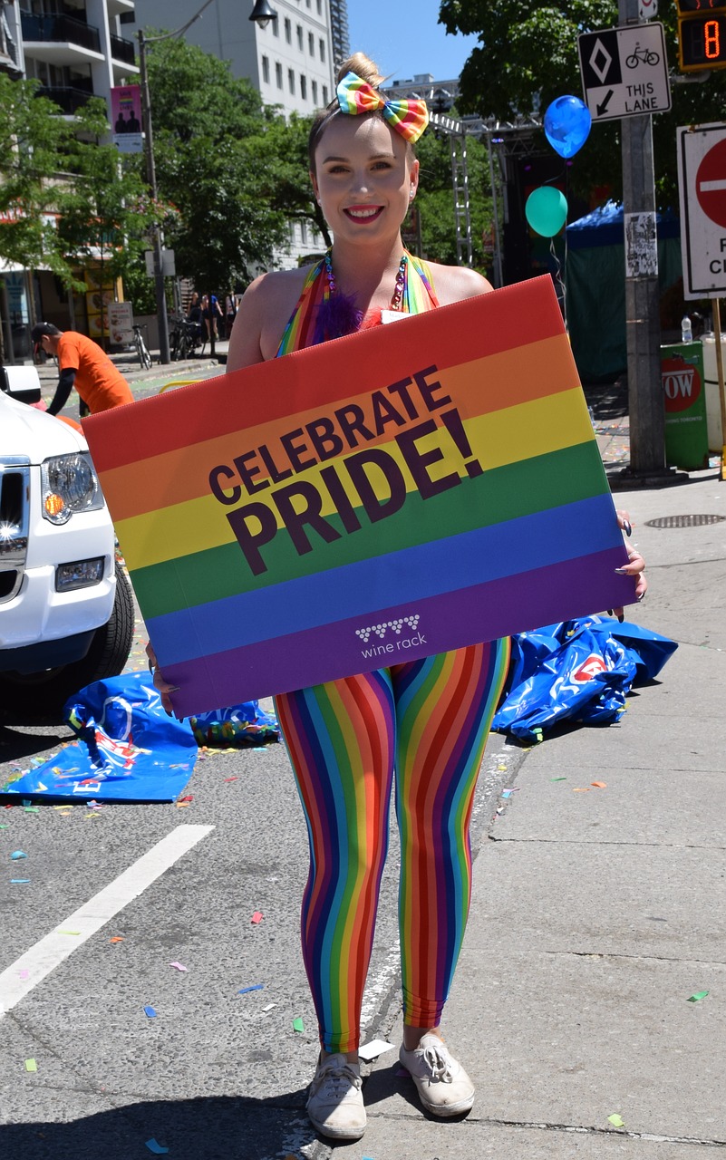 Image - woman holding pride sign woman sexy