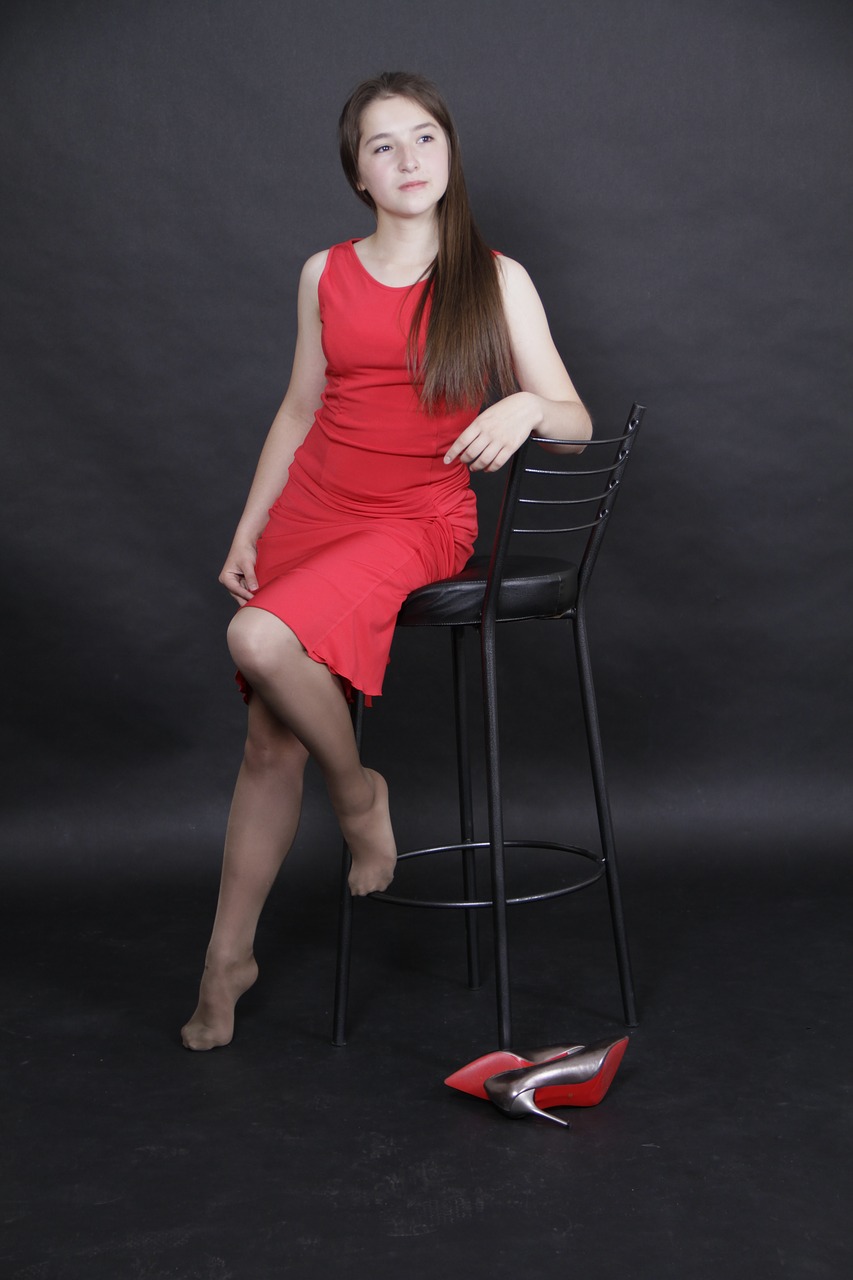 Image - girl red dress shoes shop chair