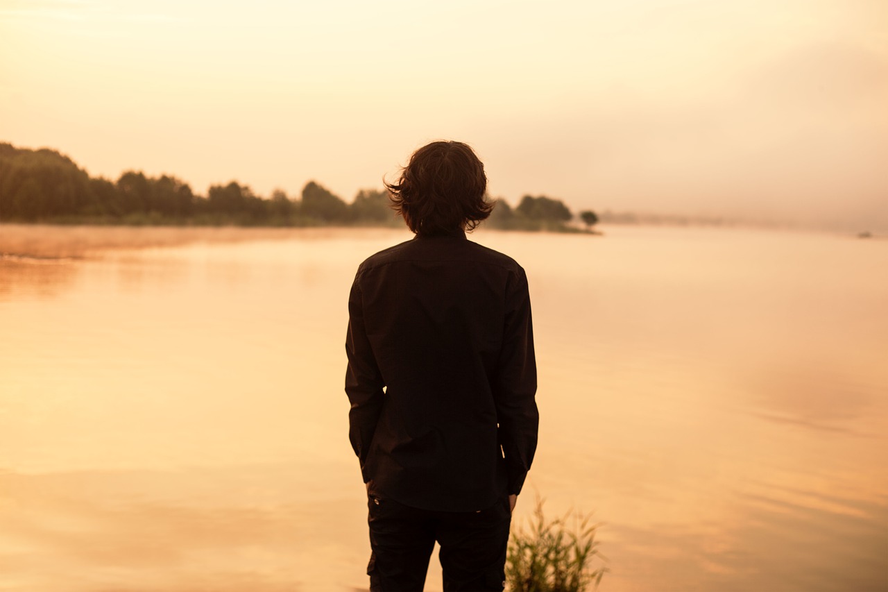 Image - man back lake black shirt