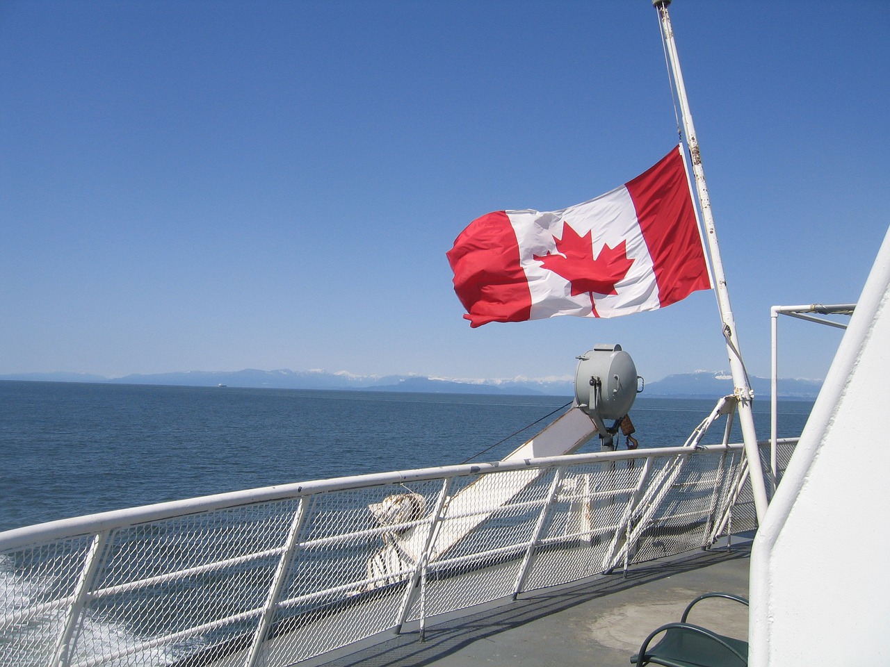 Image - canada flag boat canada water