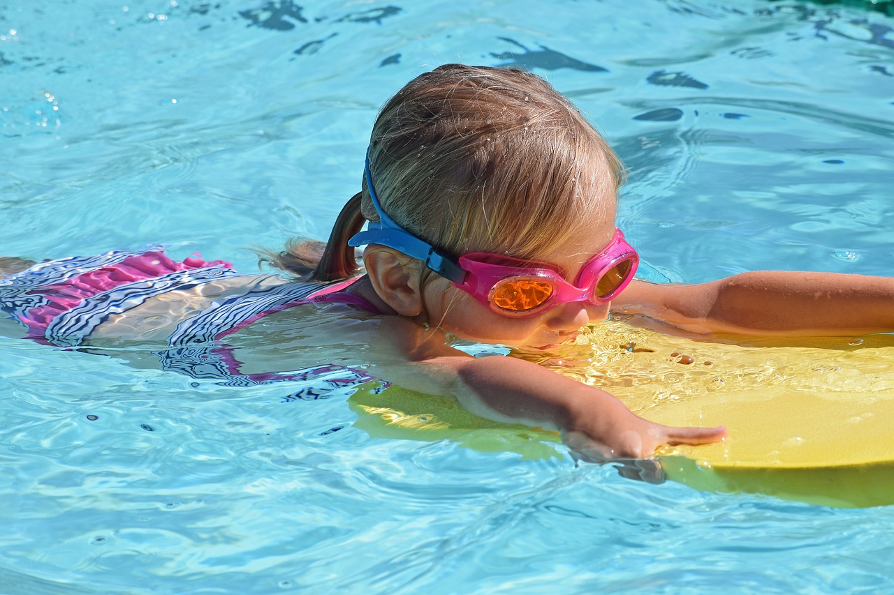 Image - young swimmer child kick board