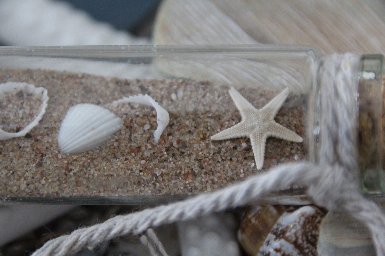 Image - starfish bottle sand