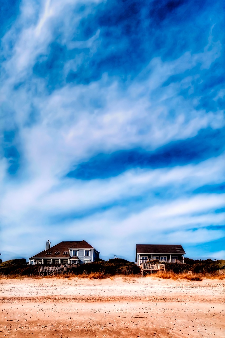 Image - beach sky clouds cottage houses