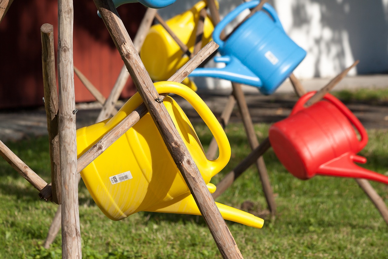 Image - watering can plastic colorful red