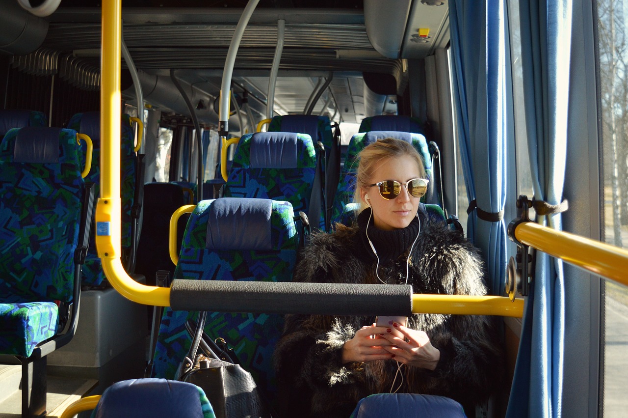 Image - bus girl earphones listening