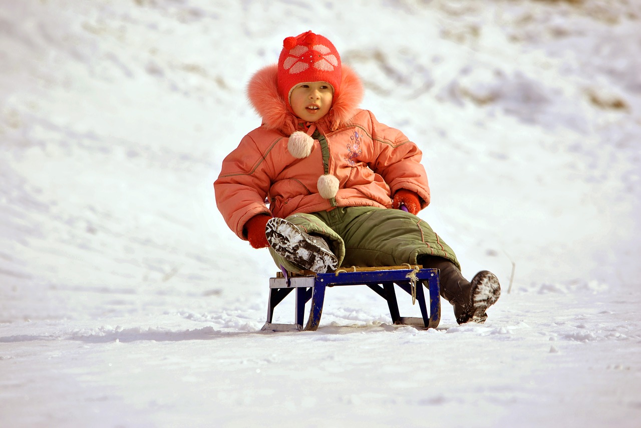 Image - girl riding sled winter