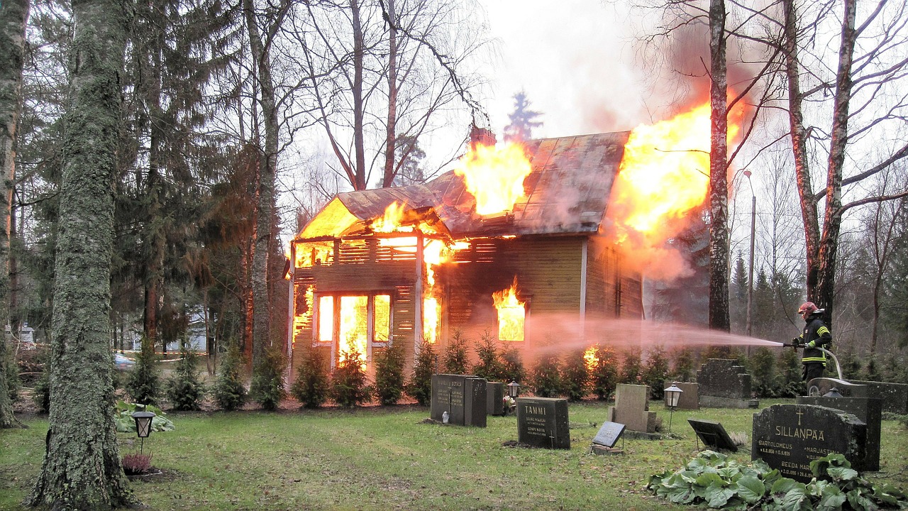 Image - fire house burns cemetery tombstone