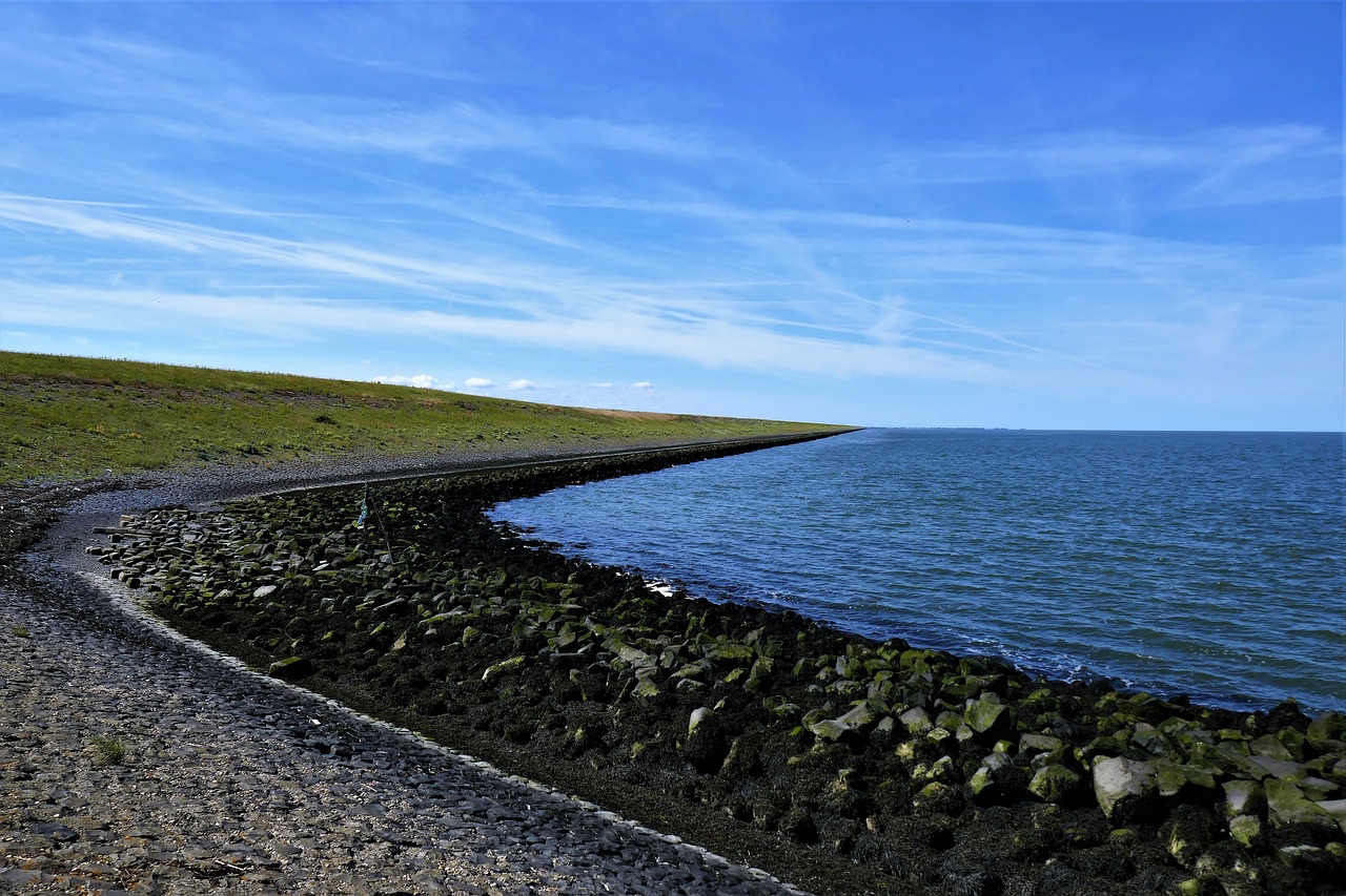 Image - dam dike water sea horizon clouds