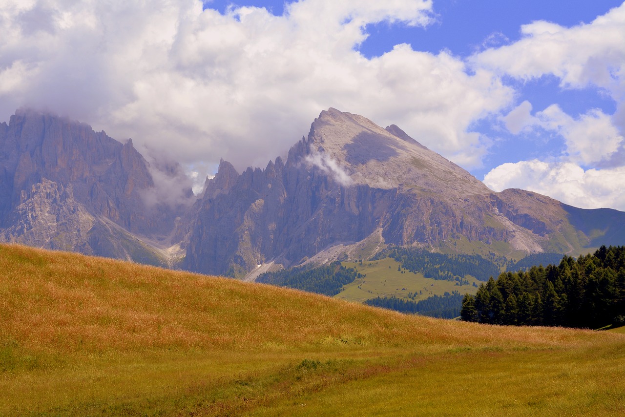 Image - dolomites cloudy sky mountains