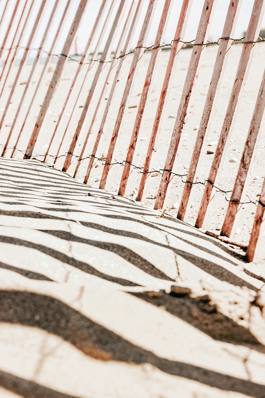 Image - beach sand brown wood fence