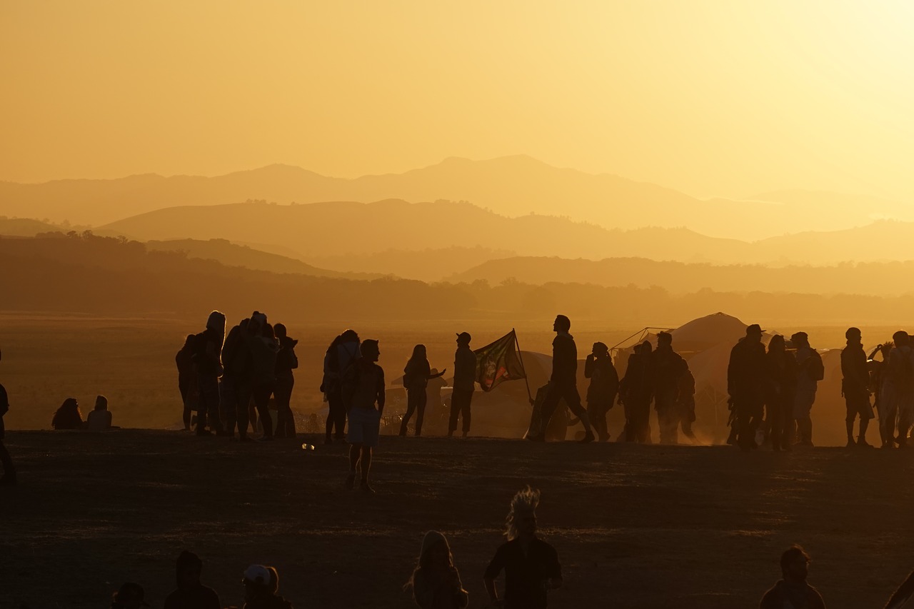 Image - people crowd mountain flag sunset